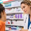 Health Pharmacist Talking To Young Black Woman Wide Web Size